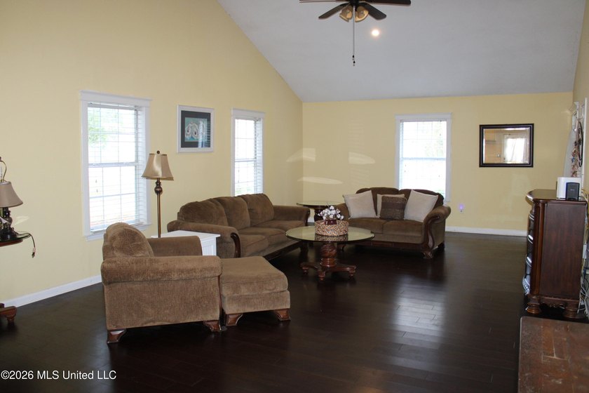 This home features an open floor plan, lots of shade from the - photo 26