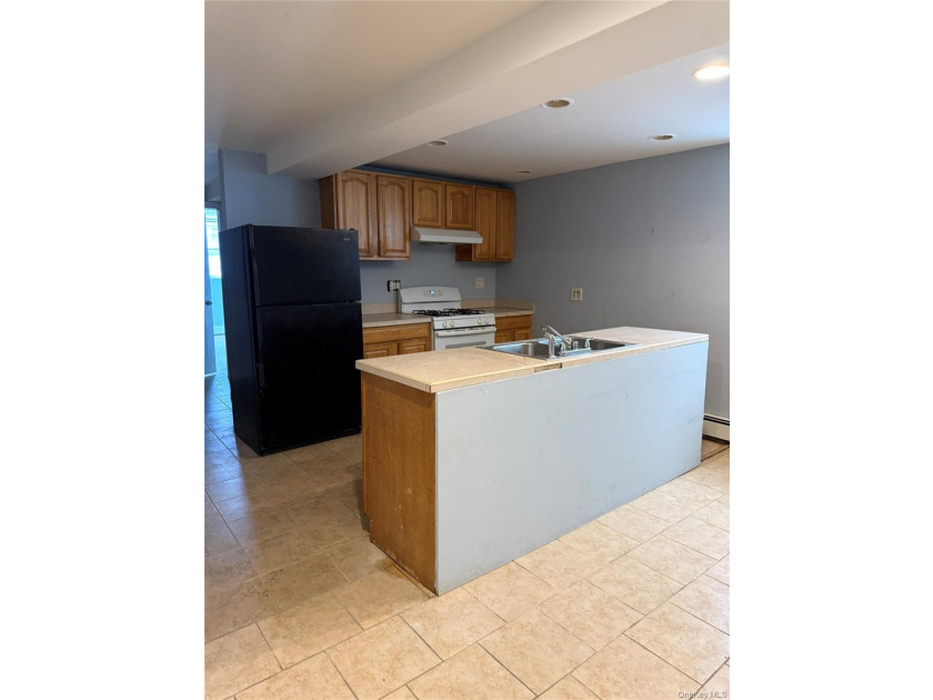 Beautiful and well-maintained legal 3-family detached home in - photo 6