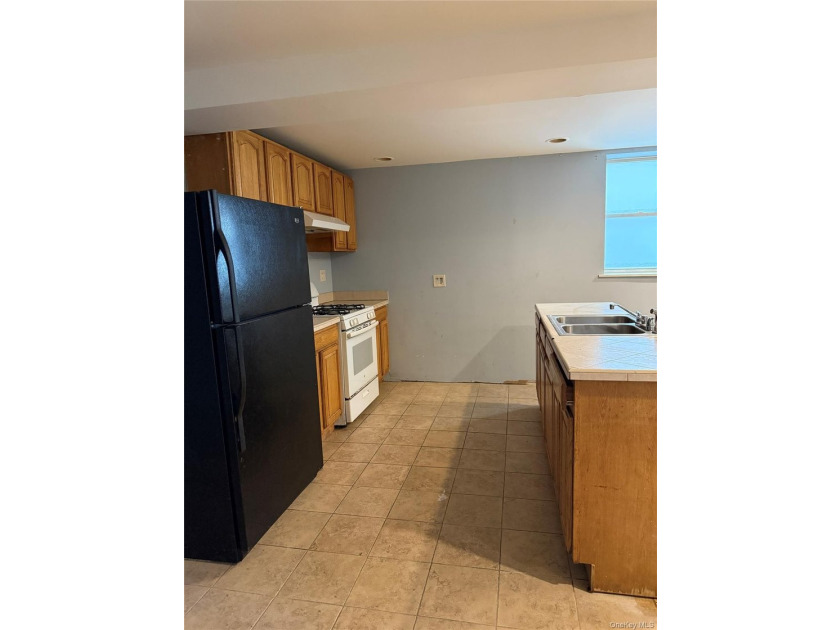 Beautiful and well-maintained legal 3-family detached home in - photo 9