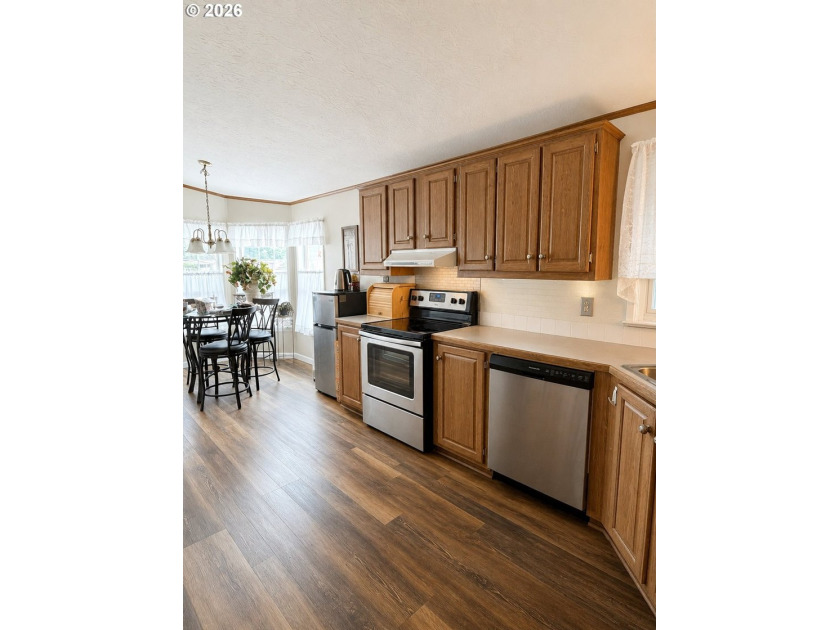 Experience tranquility at Giadanj Lake Estates with this updated - photo 10