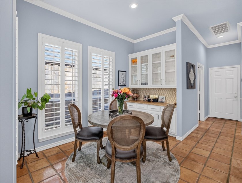 Nestled beneath mature shade trees in the prestigious gated - photo 14