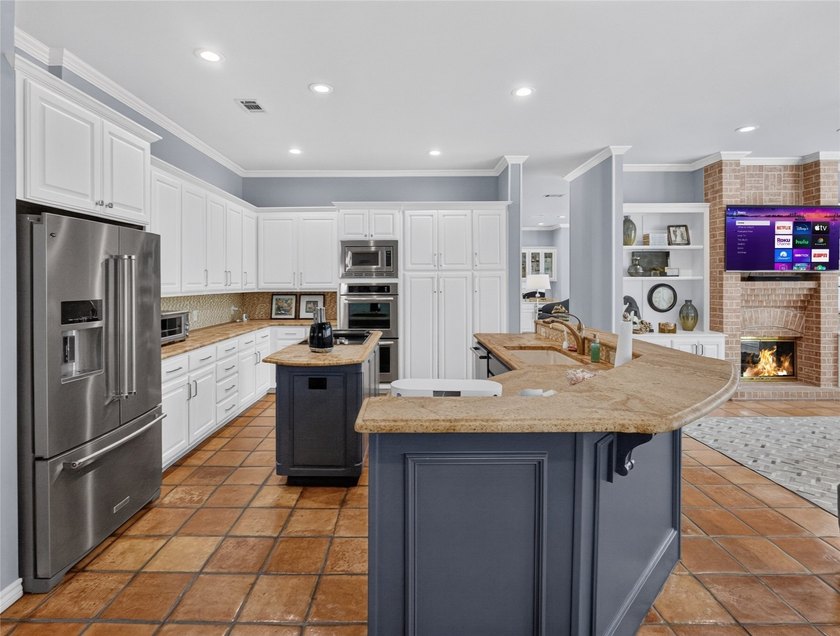 Nestled beneath mature shade trees in the prestigious gated - photo 16