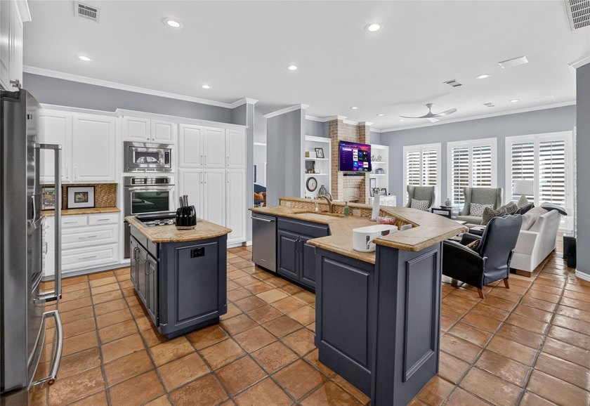 Nestled beneath mature shade trees in the prestigious gated - photo 17