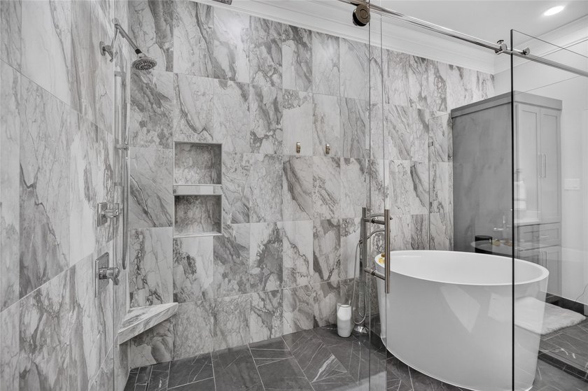 Nestled beneath mature shade trees in the prestigious gated - photo 22