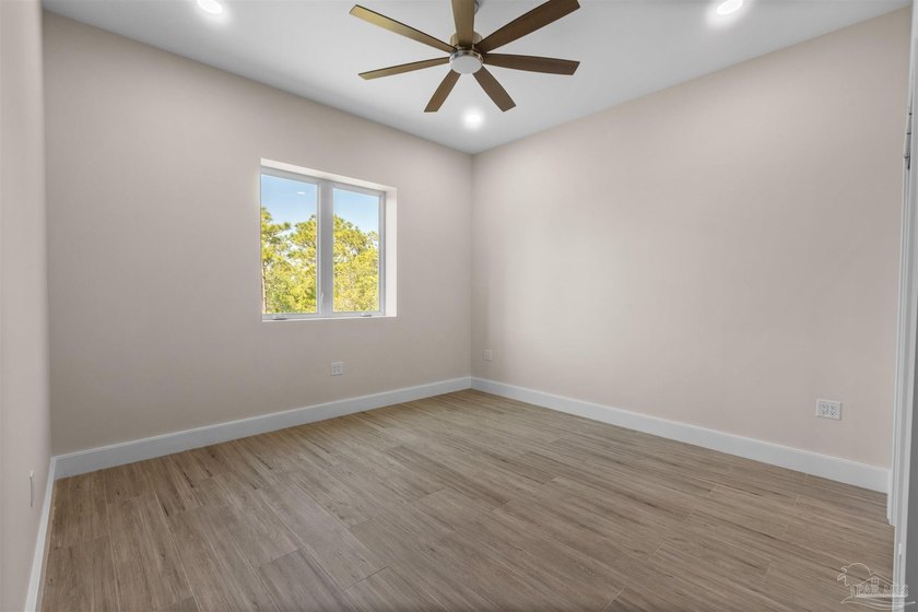 Experience modern Gulf Coast living at 5468 Cimmeron Ct in Gulf - photo 22
