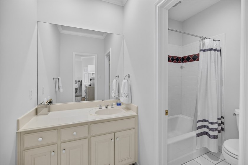 Nestled beneath mature shade trees in the prestigious gated - photo 31