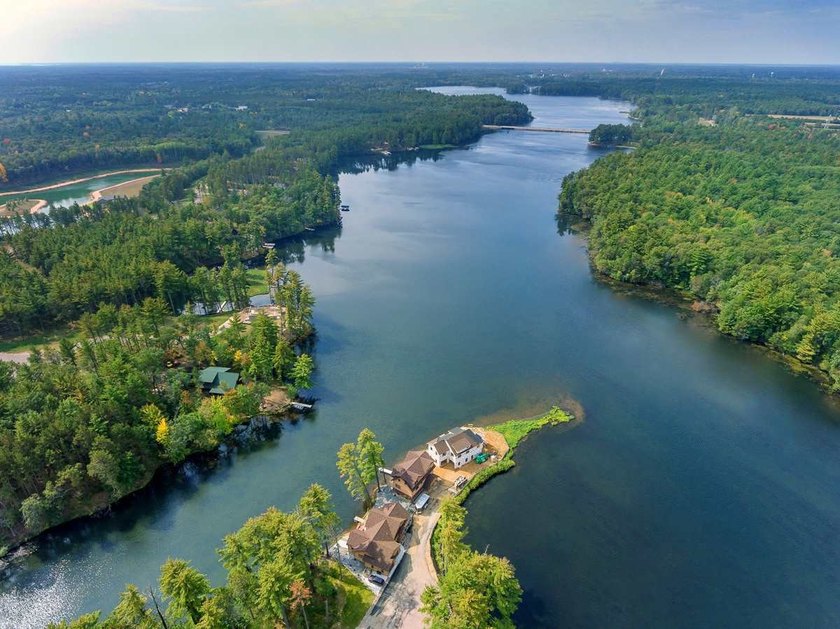 Over 60' of frontage on beautiful NEPCO Lake. This wooded lot - photo 7