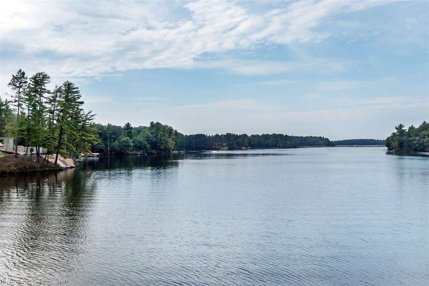 Over 60' of frontage on beautiful NEPCO Lake. This wooded lot - photo 9