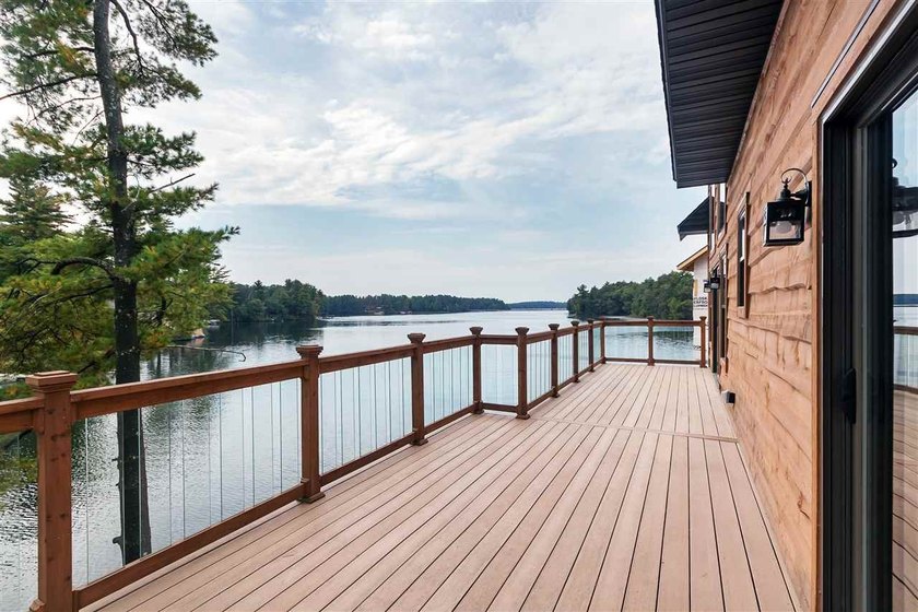 Over 60' of frontage on beautiful NEPCO Lake. This wooded lot - photo 10