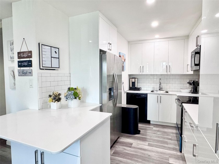Move right in! This bright, spacious, renovated 5th-floor corner - photo 3