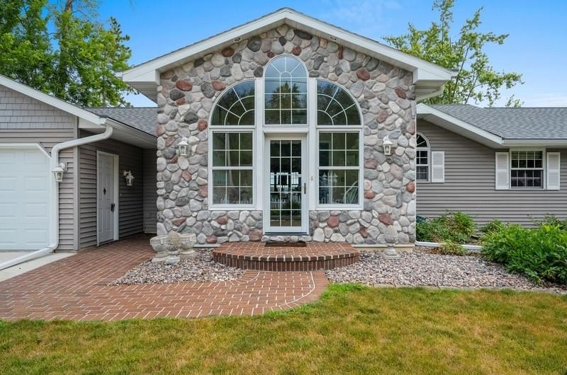 Beautiful arched-window entry welcomes you to this inviting lake - photo 3