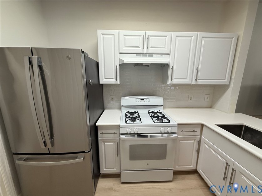 Welcome to this beautifully renovated first-floor condominium - photo 5