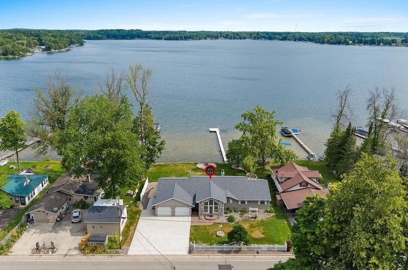 Beautiful arched-window entry welcomes you to this inviting lake - photo 5
