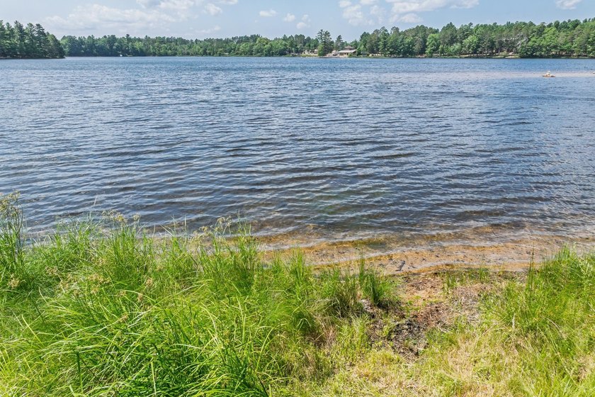 Tucked in along the quiet shores of Silver Lake in Eagle River - photo 3