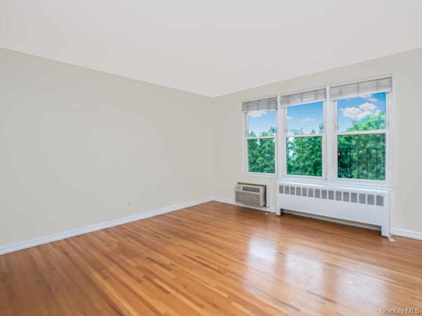Welcome home to this charming 1-bedroom top-floor walk-up - photo 4