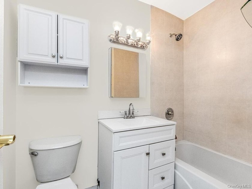Welcome home to this charming 1-bedroom top-floor walk-up - photo 5