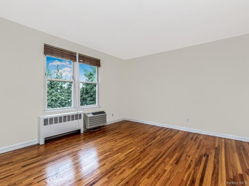 Welcome home to this charming 1-bedroom top-floor walk-up - photo 8