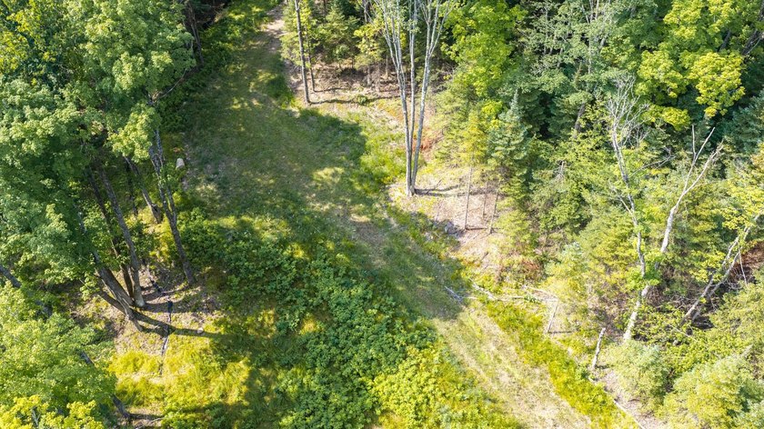Exceptional opportunity to own 4.4 wooded acres with 326 feet of - photo 4