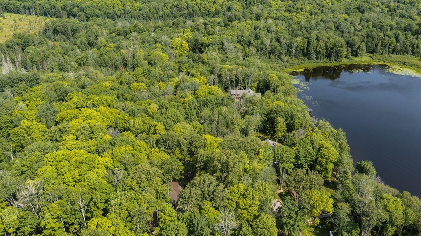 Exceptional opportunity to own 4.4 wooded acres with 326 feet of - photo 9