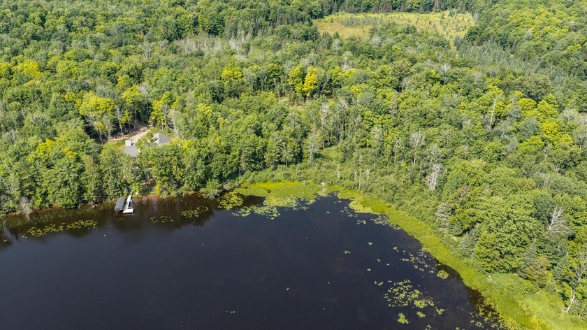 Exceptional opportunity to own 4.4 wooded acres with 326 feet of - photo 10
