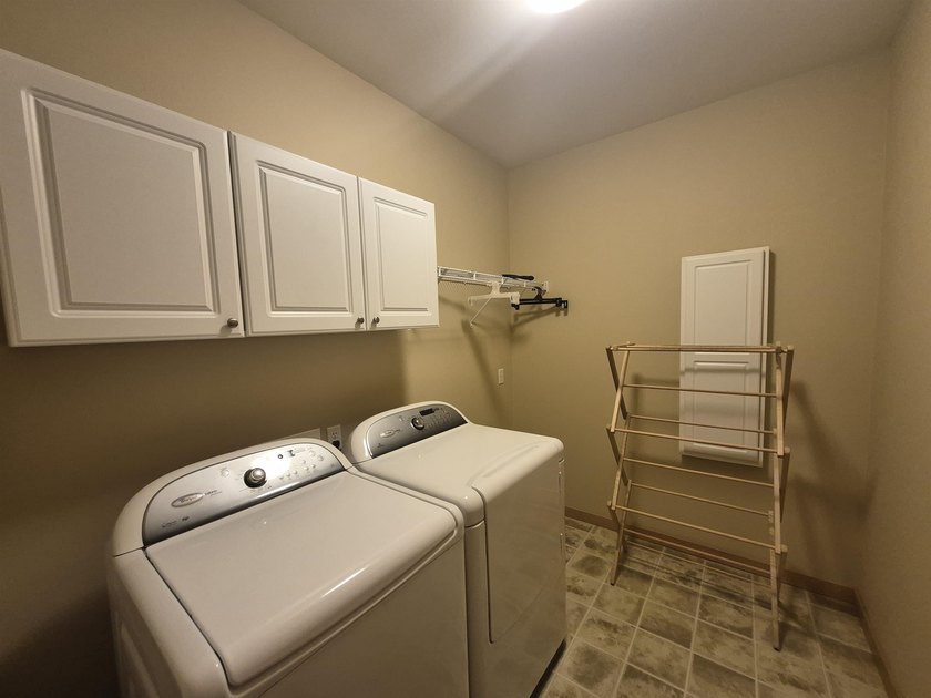 GORGEOUS COUNTRY FREE STANDING CONDO ON WOODED LOT W/WATER - photo 20