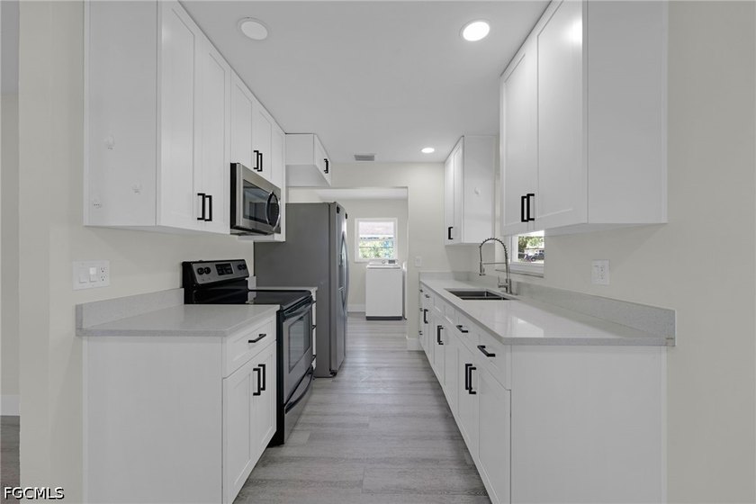 Welcome to 4800 Zana Dr in Fort Myers, a beautifully updated 3 - photo 2