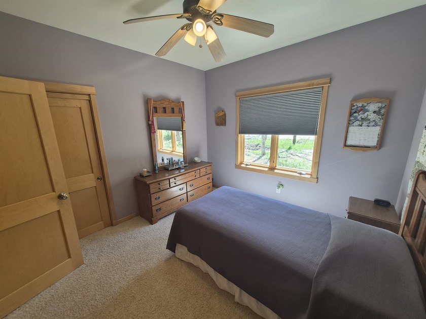GORGEOUS COUNTRY FREE STANDING CONDO ON WOODED LOT W/WATER - photo 22