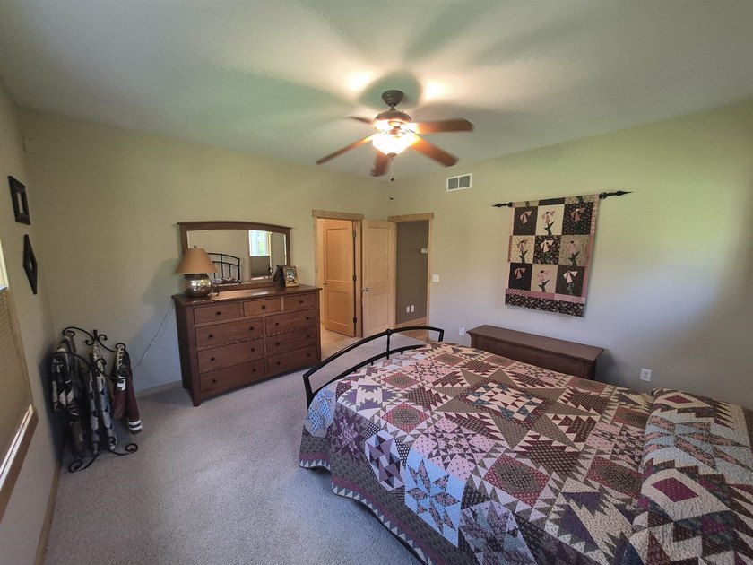 GORGEOUS COUNTRY FREE STANDING CONDO ON WOODED LOT W/WATER - photo 29