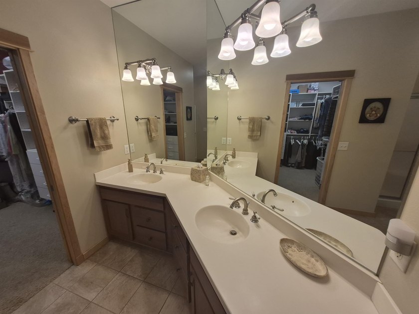 GORGEOUS COUNTRY FREE STANDING CONDO ON WOODED LOT W/WATER - photo 32
