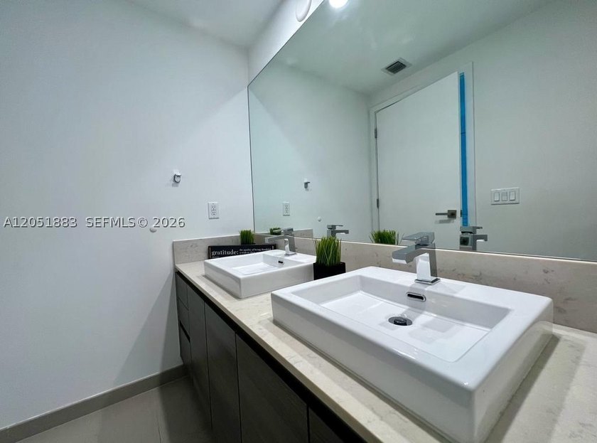 Experience sophisticated urban living in this stunning - photo 11