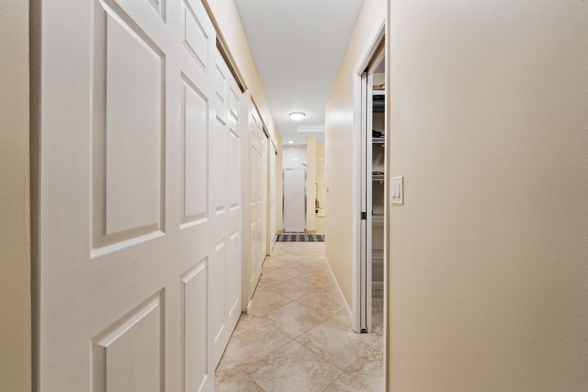 Welcome to this charming corner unit three-bedroom, two-bathroom - photo 15