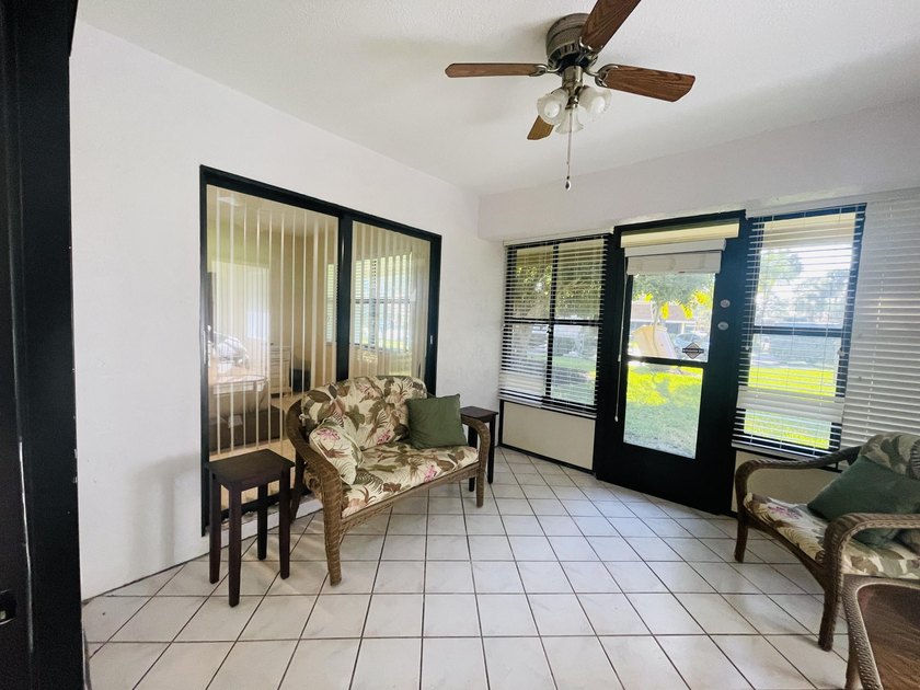 Welcome to this charming corner unit three-bedroom, two-bathroom - photo 19