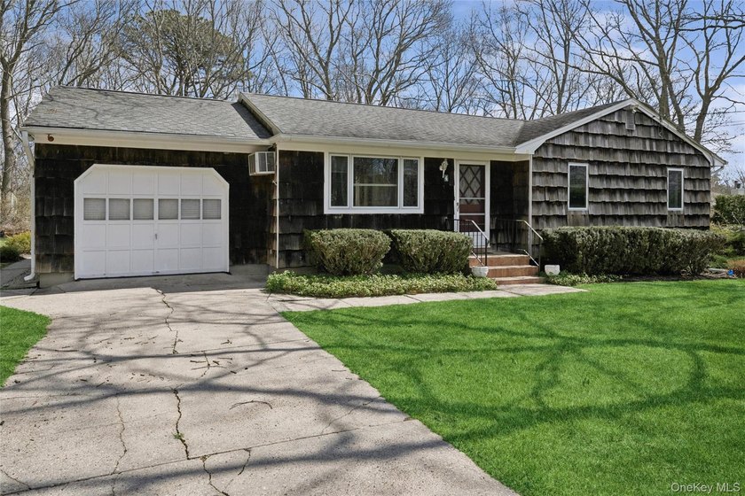 This lovely Hampton Bays residence sits on .47 acres and offers - photo 49