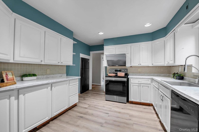 Welcome to this Great Potential Expanded Ranch in the Heart of - photo 9