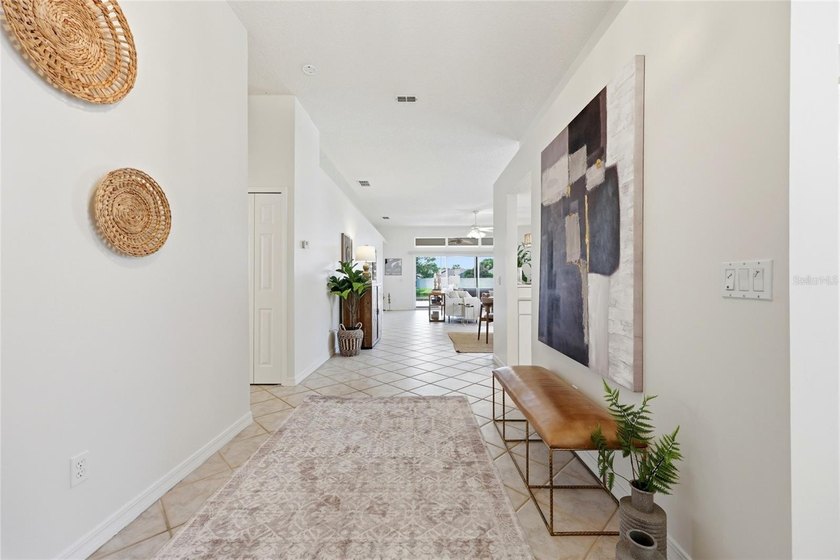 Welcome to easy coastal living in the highly sought-after gated - photo 3