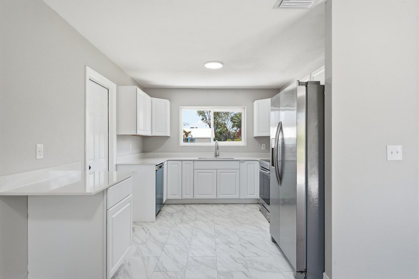BRAND NEW ROOF, NEW A/C SYSTEM, FULLY RENOVATED .This - photo 10