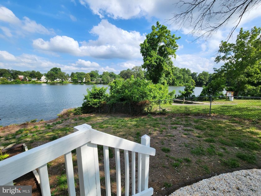 Nestled on the serene banks of Johnson Pond, this charming - photo 3