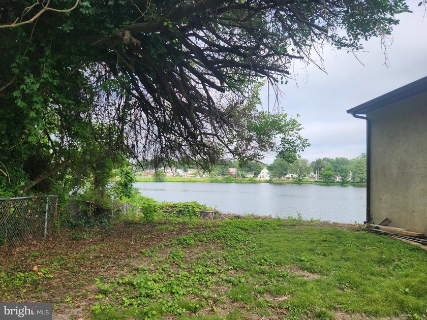 Nestled on the serene banks of Johnson Pond, this charming - photo 8