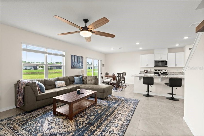 This 5-bedroom, 3-bath home sits on a spacious lakefront lot in - photo 4