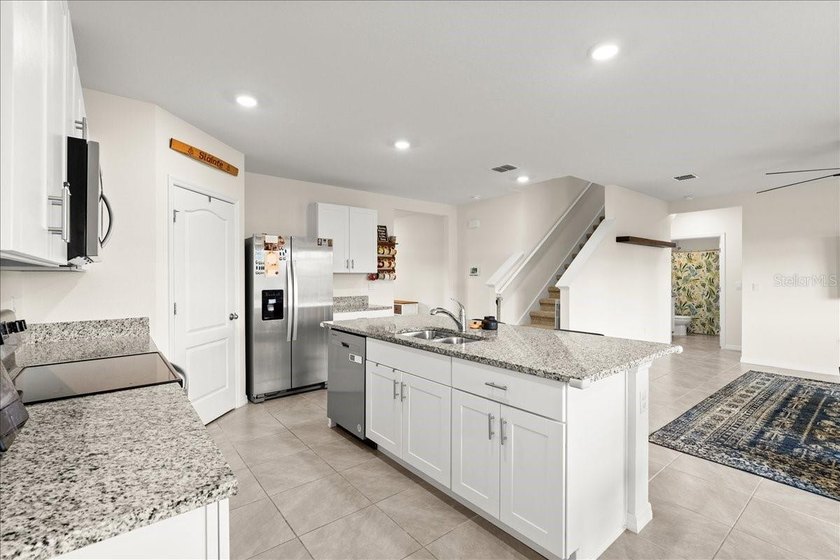 This 5-bedroom, 3-bath home sits on a spacious lakefront lot in - photo 8