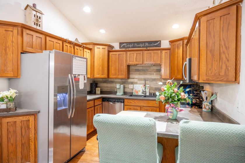 Each unit features a spacious, open~concept layout where the - photo 6