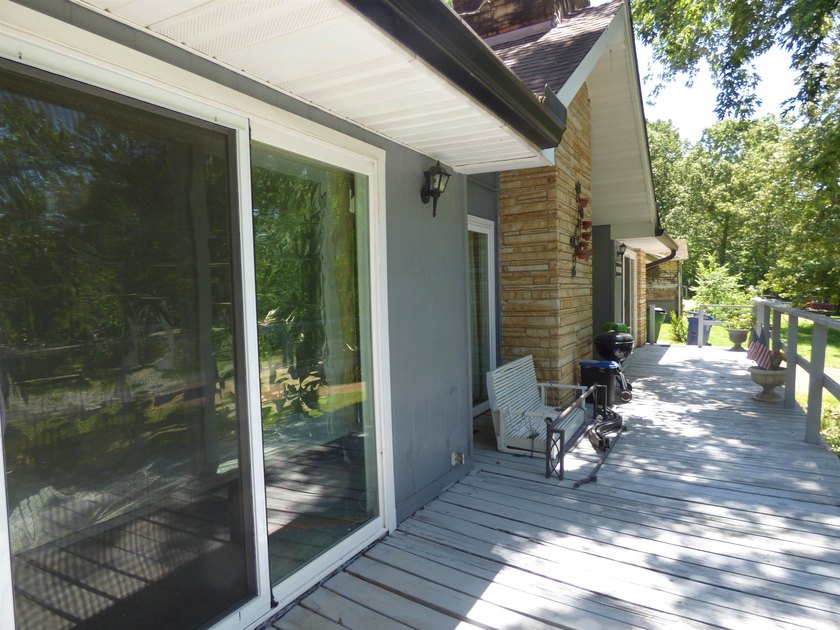 Surrounded by mature trees and just minutes from Crown Lake this - photo 4