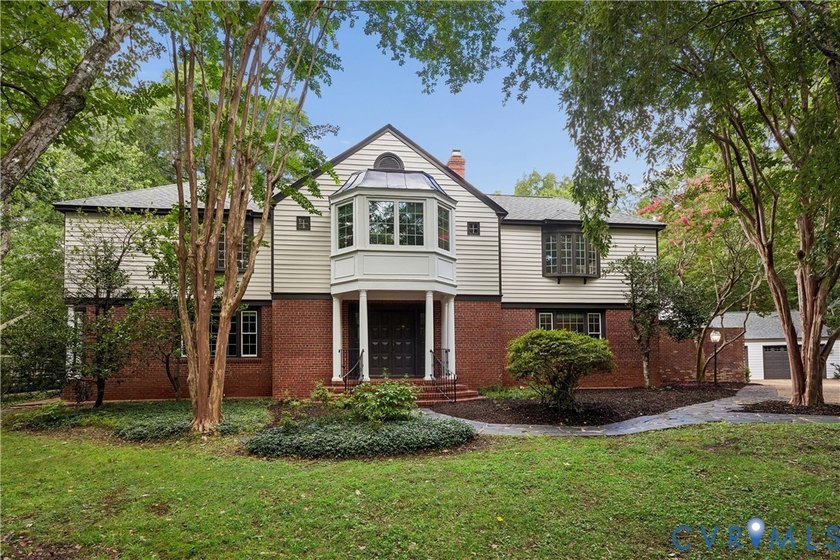 Hidden among mature trees on a rare double lot, this exceptional - photo 5