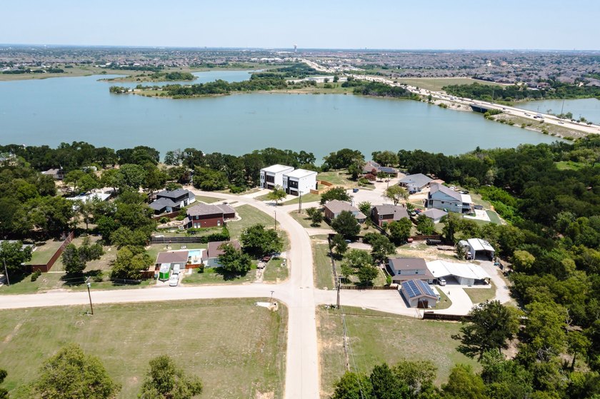 Experience modern waterfront luxury in this stunning - photo 5