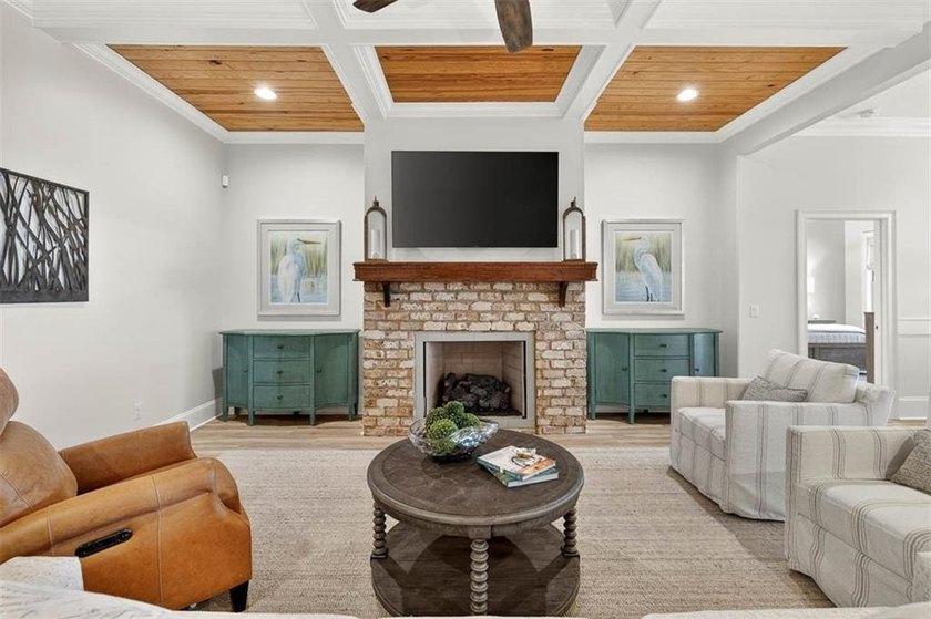 Welcome to a refined coastal sanctuary in the gated enclave of - photo 11