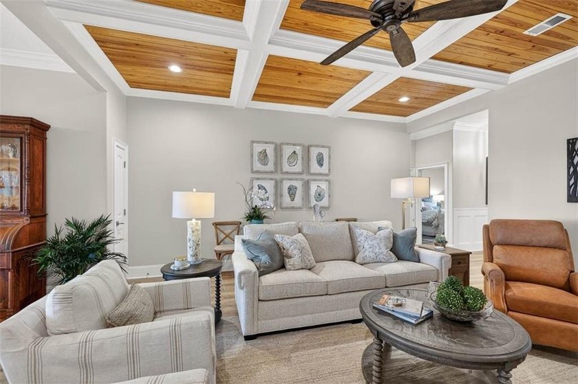Welcome to a refined coastal sanctuary in the gated enclave of - photo 12