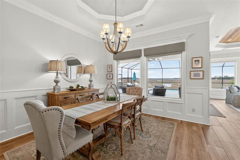 Welcome to a refined coastal sanctuary in the gated enclave of - photo 13