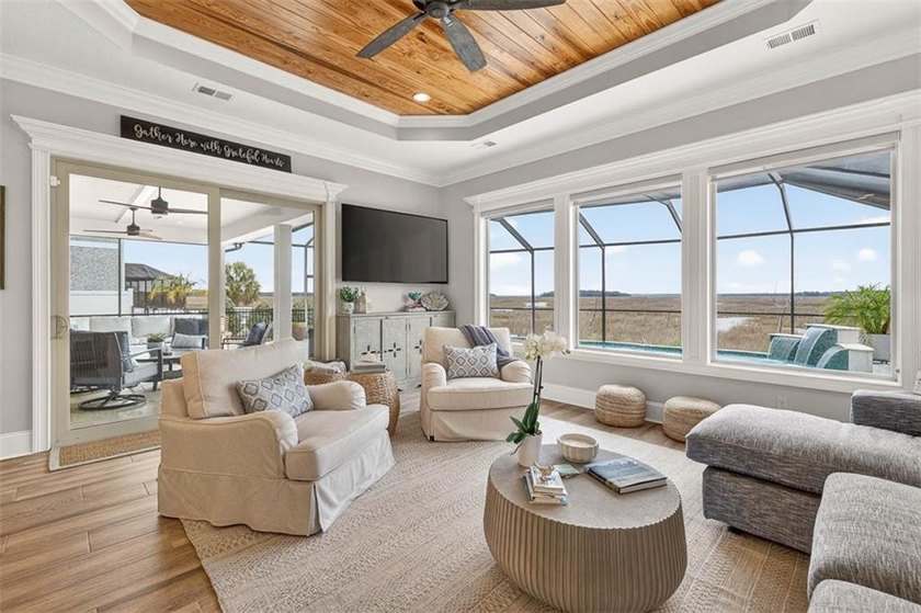 Welcome to a refined coastal sanctuary in the gated enclave of - photo 15