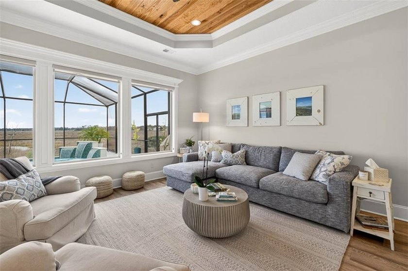 Welcome to a refined coastal sanctuary in the gated enclave of - photo 16