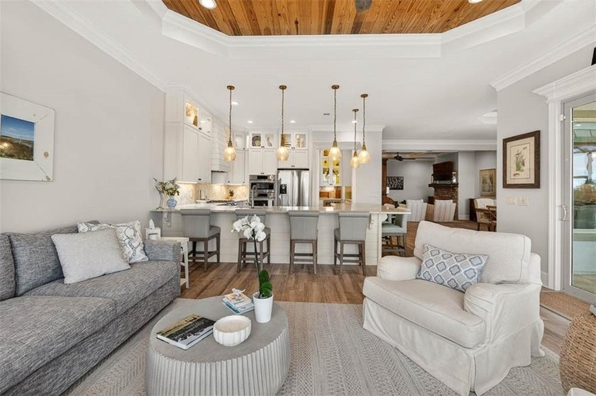 Welcome to a refined coastal sanctuary in the gated enclave of - photo 17